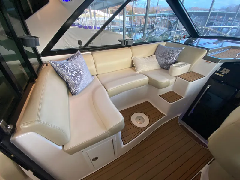 Slide: The Image of Luxurious interior of 2012 Regal 42 Sport Coupe with beige seating and wooden flooring. - 18