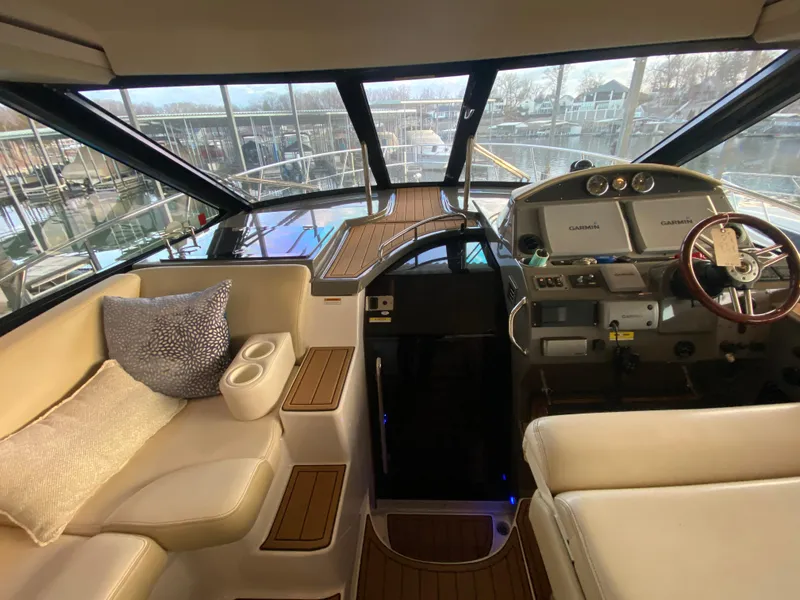 Slide: The Image of Interior of 2012 Regal 42 Sport Coupe yacht with luxurious seating and modern helm. - 20