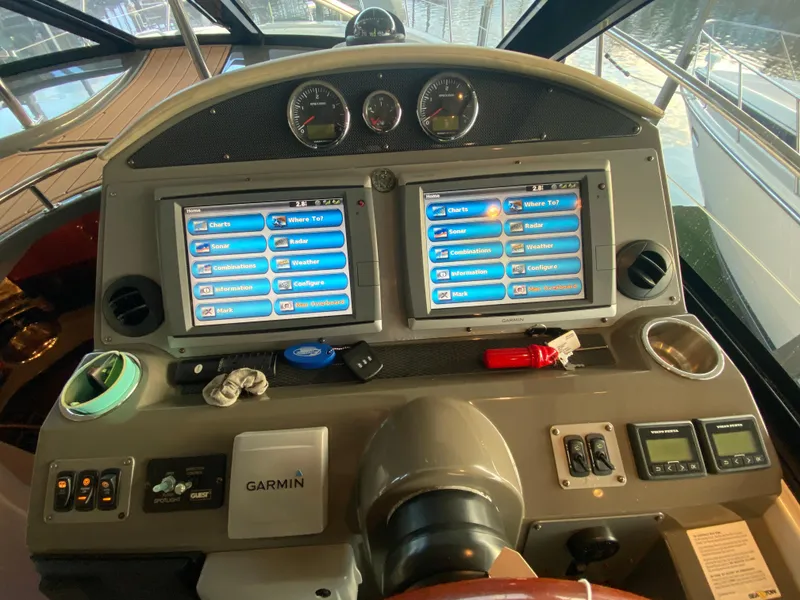 Slide: The Image of Cockpit of 2012 Regal 42 Sport Coupe with dual Garmin navigation screens. - 22