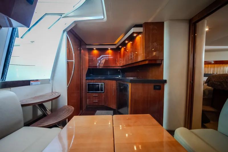 Slide: The Image of Luxurious interior of 2012 Regal 42 Sport Coupe yacht with modern kitchen amenities. - 47