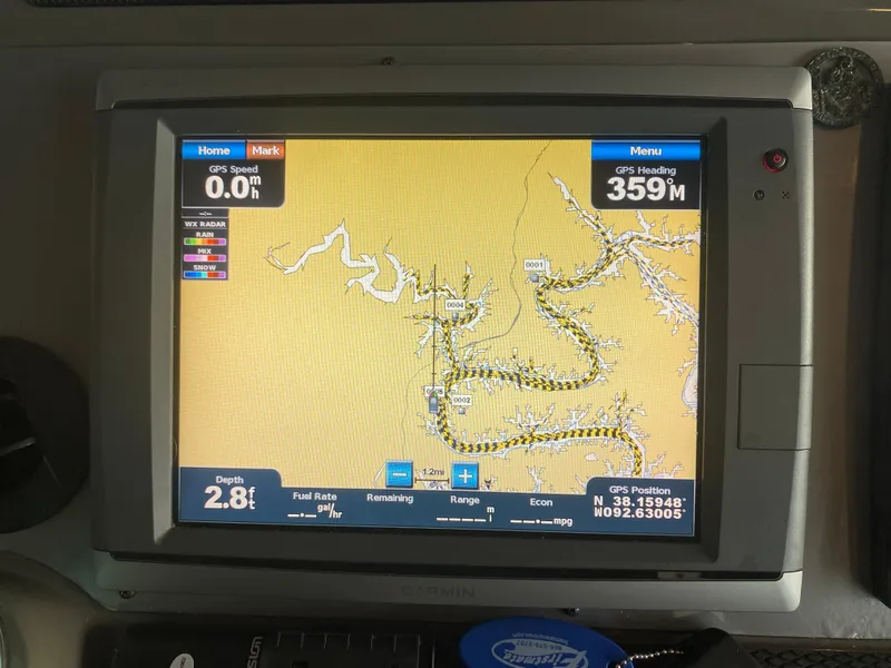 Slide: The Image of GPS navigation screen on a 2012 Regal 42 Sport Coupe, showing map and coordinates. - 24