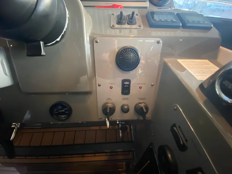 Slide: The Image of Control panel of a 2012 Regal 42 Sport Coupe boat cockpit. - 29