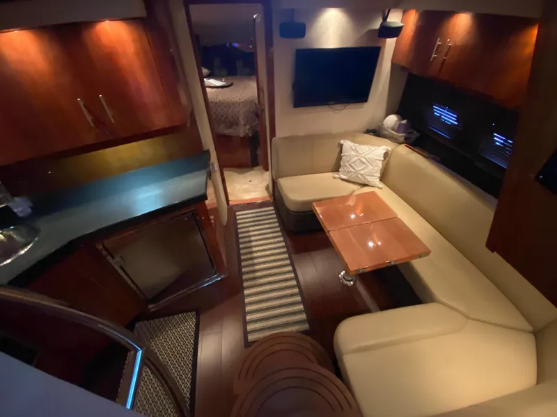 Slide: The Image of Luxurious interior of 2012 Regal 42 Sport Coupe with cozy seating and modern amenities. - 33