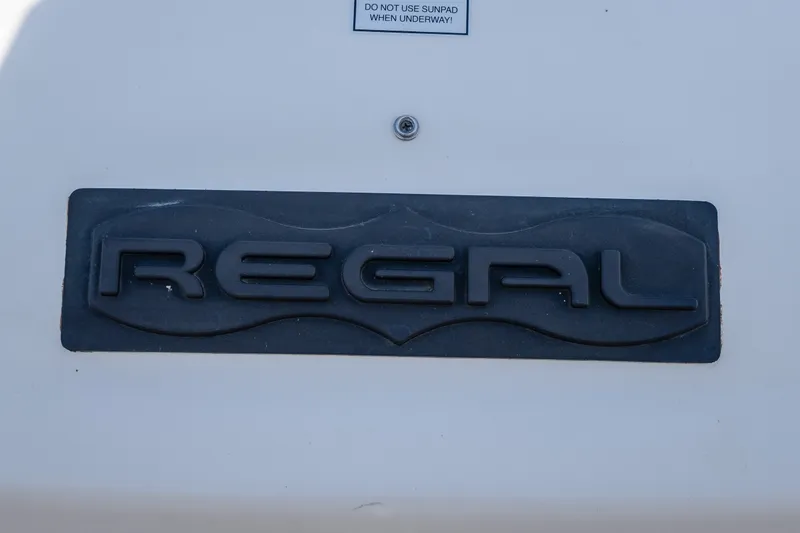 Slide: The Image of Regal 42 Sport Coupe 2012 logo on boat exterior. - 62