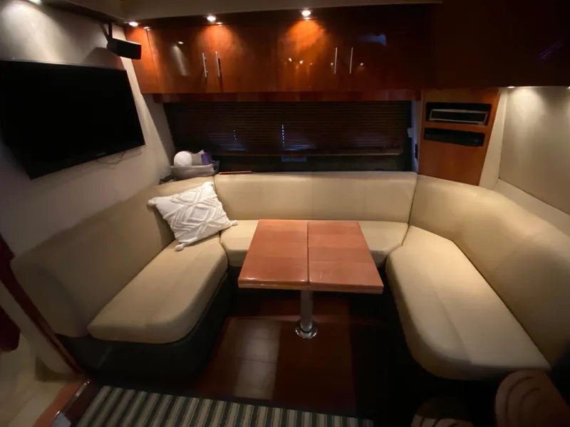 Slide: The Image of Luxurious interior of 2012 Regal 42 Sport Coupe with cozy seating and wooden table. - 35