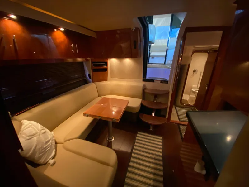 Slide: The Image of Interior of 2012 Regal 42 Sport Coupe with bed, TV, and wooden door. - 42