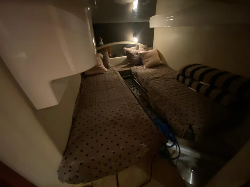 Slide: The Image of Luxurious interior of 2012 Regal 42 Sport Coupe with wooden cabinetry and patterned flooring. - 43