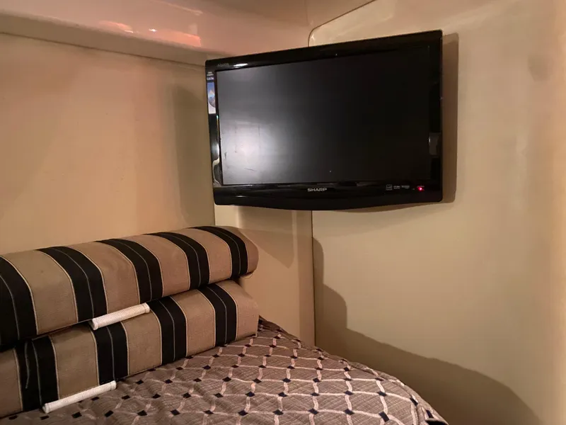 Slide: The Image of Bathroom interior of 2012 Regal 42 Sport Coupe yacht, featuring sink and toilet. - 44