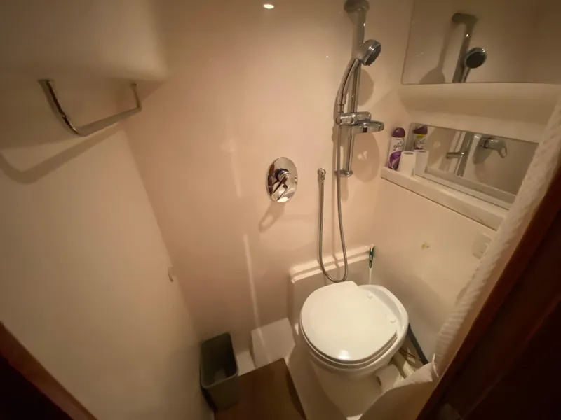 Slide: The Image of Compact bathroom in 2012 Regal 42 Sport Coupe yacht with shower and toilet. - 48