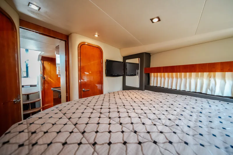 Slide: The Image of Luxurious interior of 2012 Regal 42 Sport Coupe yacht bedroom with modern amenities. - 55