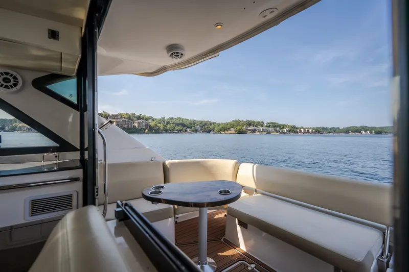 Slide: The Image of Luxurious 2012 Regal 42 Sport Coupe yacht interior with scenic lake view. - 24