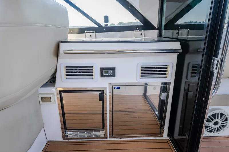 Slide: The Image of Interior of 2012 Regal 42 Sport Coupe yacht with sleek cabinetry and modern design. - 27