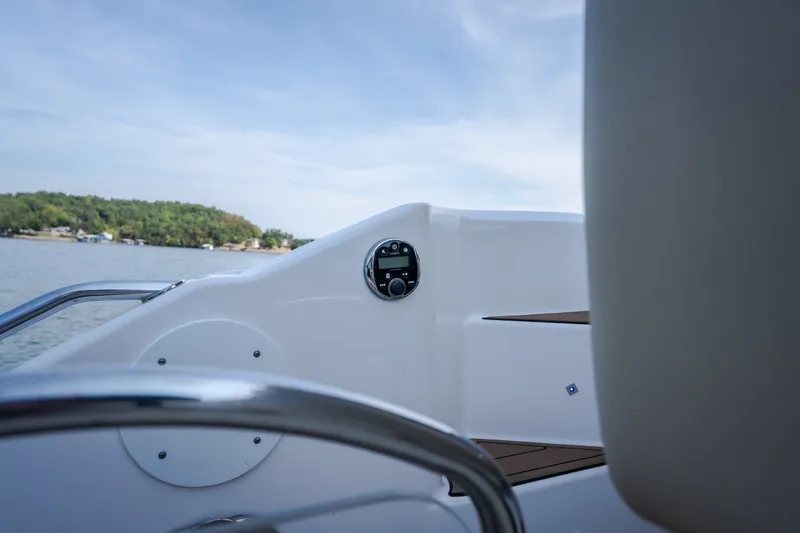 Slide: The Image of 2012 Regal 42 Sport Coupe boat interior with lake view and control panel. - 20
