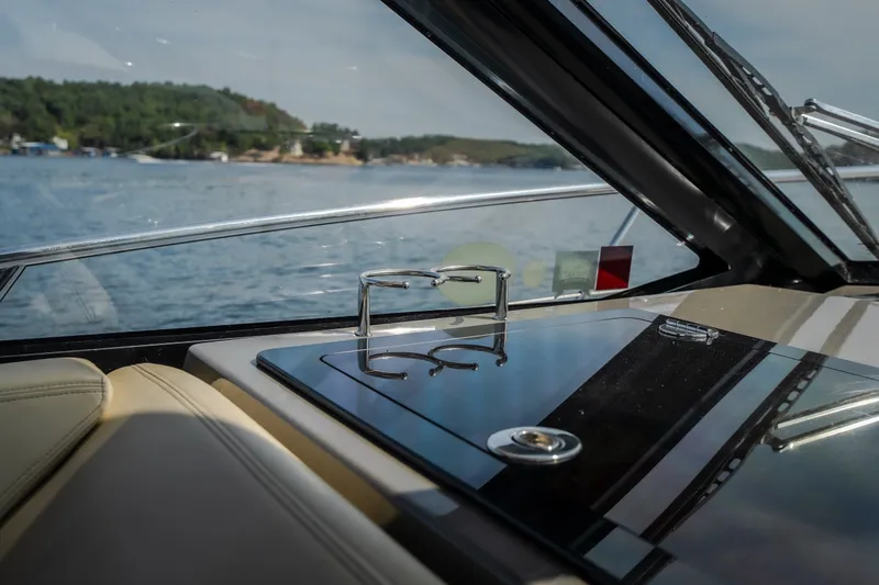 Slide: The Image of Interior view of 2012 Regal 42 Sport Coupe yacht with scenic water backdrop. - 35