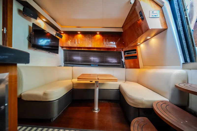Slide: The Image of Luxurious interior of 2012 Regal 42 Sport Coupe with plush seating and modern amenities. - 46