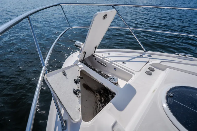 Slide: The Image of Open anchor compartment on 2012 Regal 42 Sport Coupe yacht, with ocean backdrop. - 44