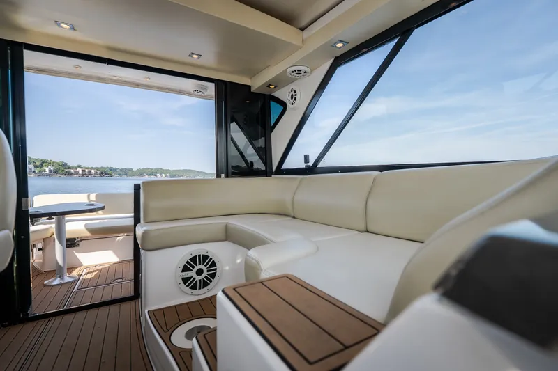 Slide: The Image of Luxurious interior of 2012 Regal 42 Sport Coupe yacht with scenic water view. - 26