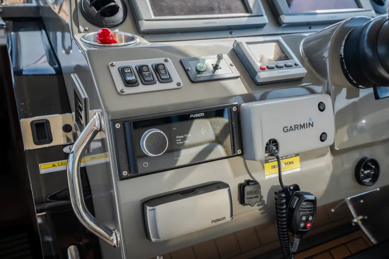 Slide: The Image of Control panel of a 2012 Regal 42 Sport Coupe with Garmin navigation system. - 32
