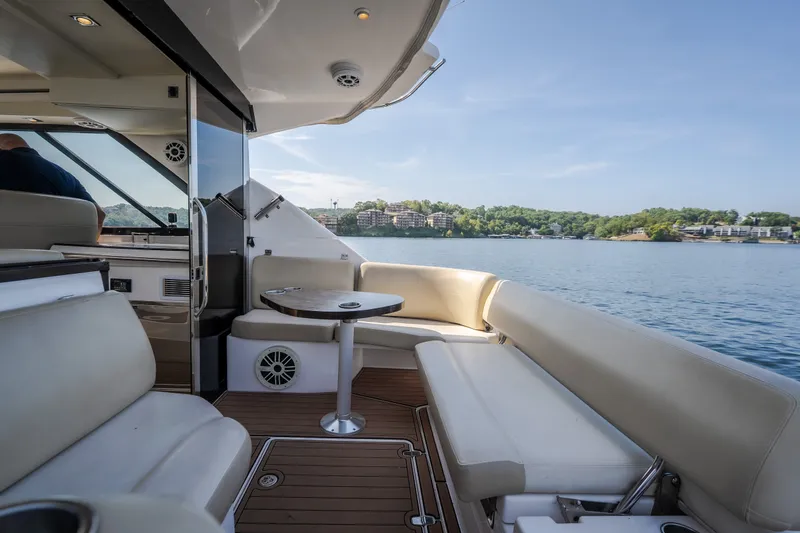 Slide: The Image of Luxurious interior of 2012 Regal 42 Sport Coupe yacht with scenic water view. - 21