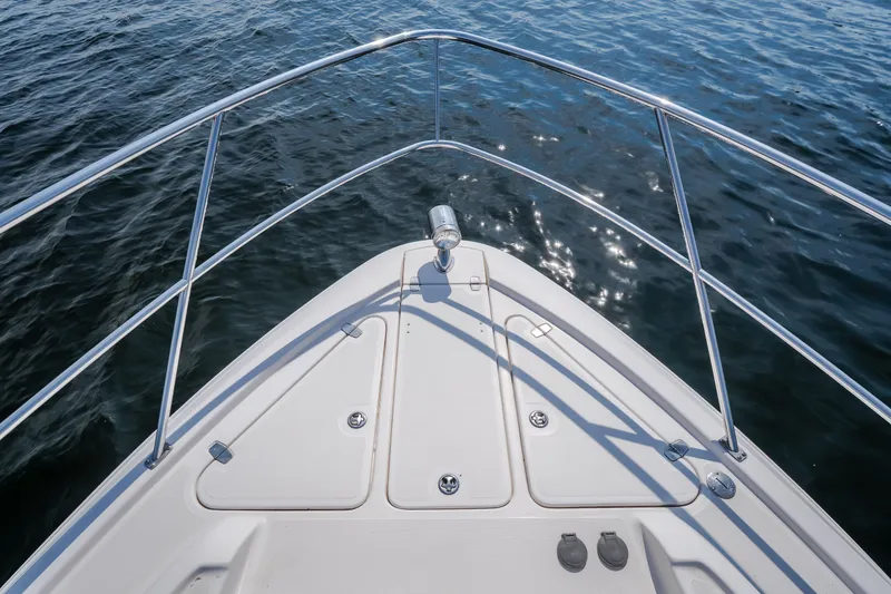 Slide: The Image of Bow view of 2012 Regal 42 Sport Coupe on calm water. - 43