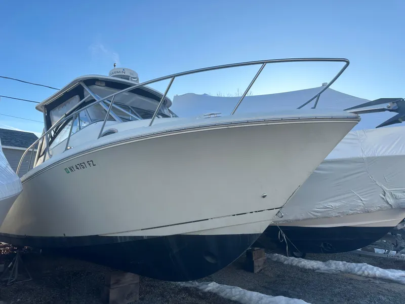 Slide: The Image of 2007 Sailfish 30-06 Express boat on dry dock, side view. - 10