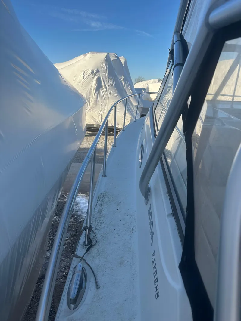 Slide: The Image of 2007 Sailfish 30-06 Express boat docked, side view with clear sky. - 4