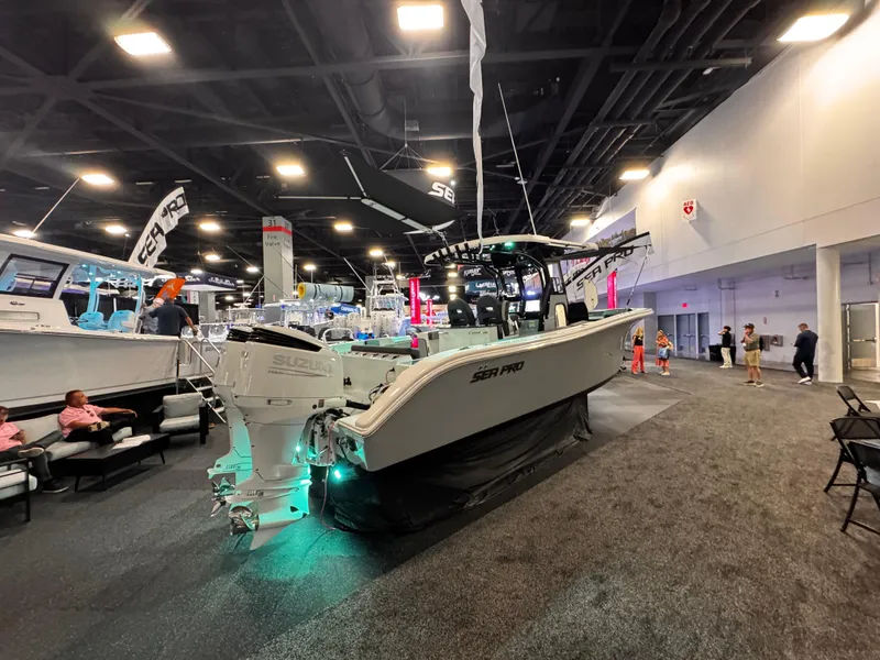 Slide: The Image of 2025 Sea Pro 292 DLX boat displayed at an indoor exhibition. - 11