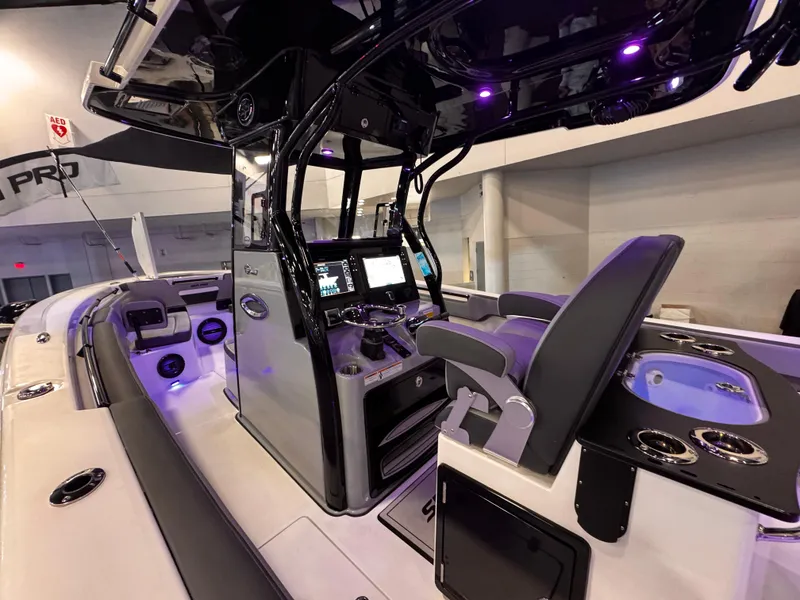 Slide: The Image of 2025 Sea Pro 292 DLX boat interior with modern dashboard and seating. - 14