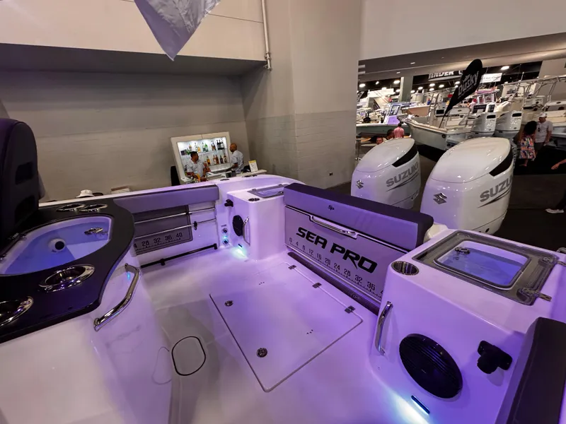 Slide: The Image of 2025 Sea Pro 292 DLX boat interior with modern features and Suzuki engines. - 15