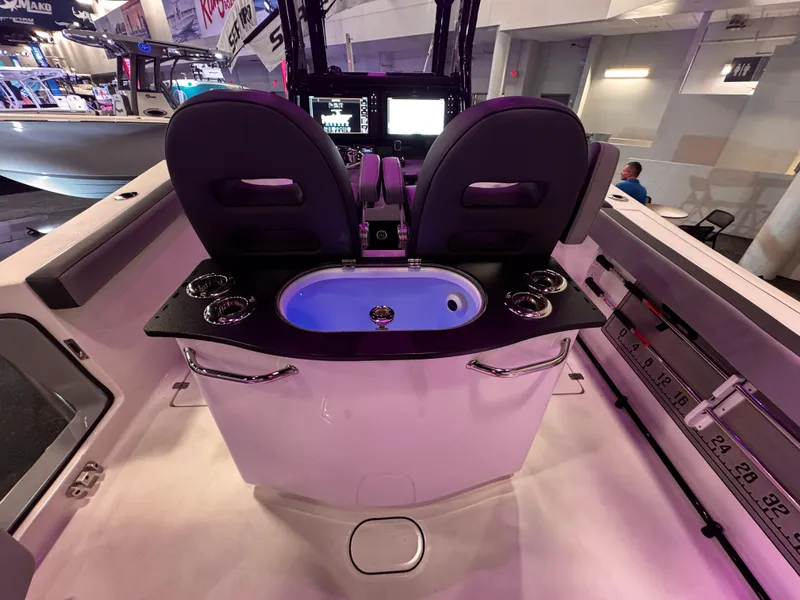 Slide: The Image of 2025 Sea Pro 292 DLX boat interior with dual seats and illuminated console. - 16