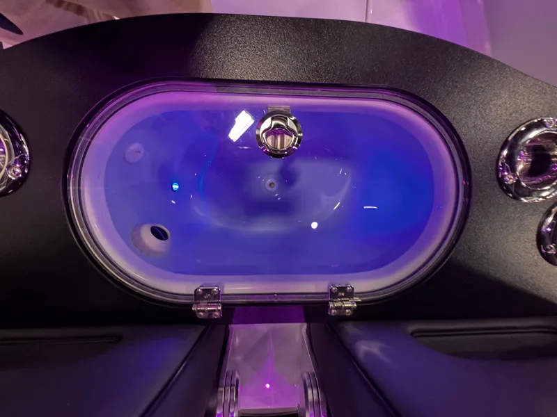 Slide: The Image of 2025 Sea Pro 292 DLX boat livewell with blue LED lighting. - 17