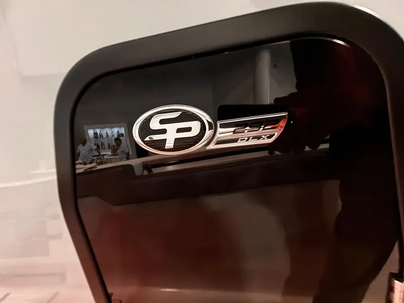 Slide: The Image of 2025 Sea Pro 292 DLX logo on a sleek black surface. - 22