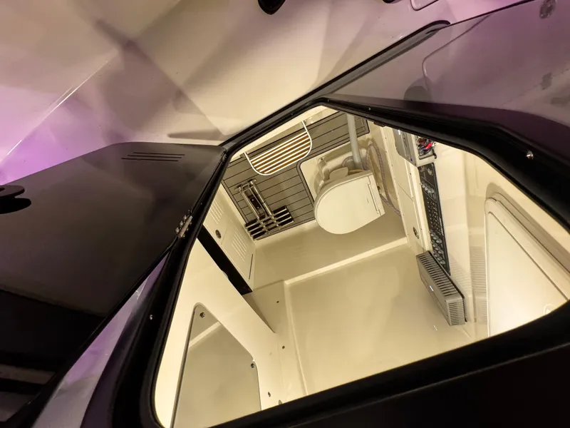 Slide: The Image of Interior view of 2025 Sea Pro 292 DLX boat cabin with modern amenities. - 23