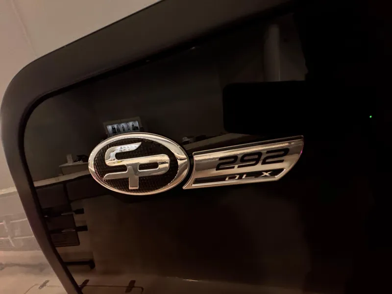 Slide: The Image of 2025 Sea Pro 292 DLX logo on a sleek black surface. - 25