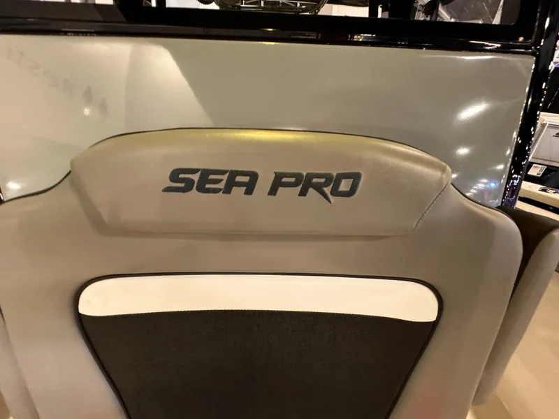 Slide: The Image of 2025 Sea Pro 292 DLX boat seat with logo, featuring sleek design and comfortable padding. - 29