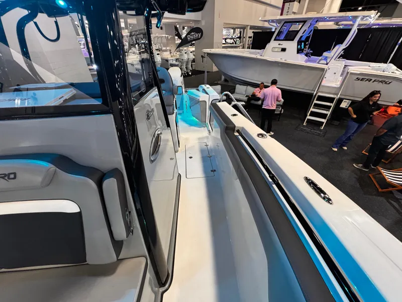 Slide: The Image of 2025 Sea Pro 292 DLX boat interior at a marine exhibition. - 35