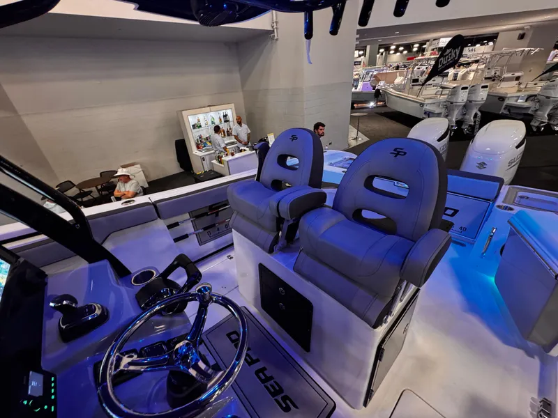 Slide: The Image of Interior view of 2025 Sea Pro 292 DLX boat with modern seating and controls. - 36