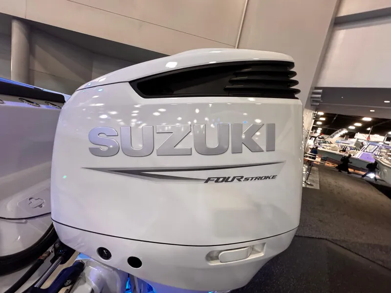 Slide: The Image of Suzuki four-stroke outboard motor on 2025 Sea Pro 292 DLX boat. - 8