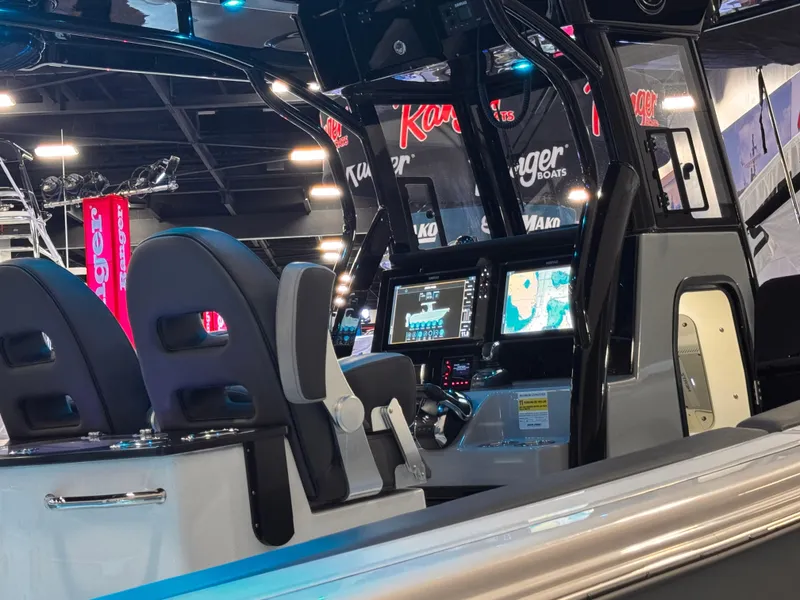 Slide: The Image of 2025 Sea Pro 292 DLX boat interior with advanced navigation system at a boat show. - 9