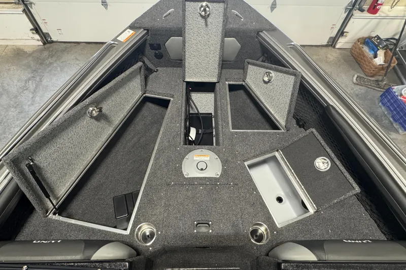 Slide: The Image of Interior view of 2025 Lund 1975 Tyee boat with open storage compartments. - 10