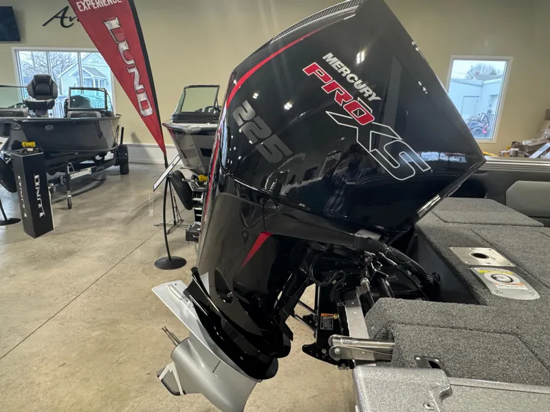 Slide: The Image of Lund 1975 Tyee 2025 boat with Mercury Pro XS 225 engine in showroom. - 11