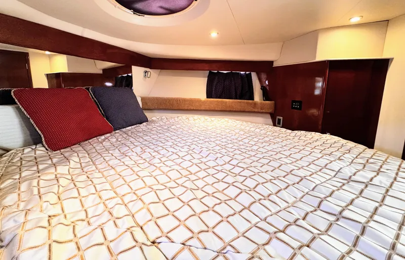 Slide: The Image of Luxurious bedroom interior of a 2006 Meridian 341 Sedan yacht with elegant bedding. - 22