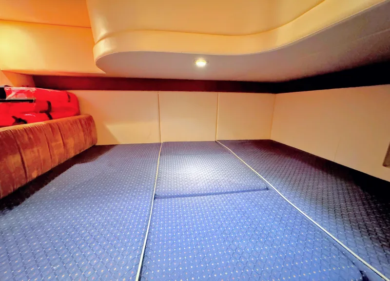 Slide: The Image of Interior cabin of a 2006 Meridian 341 Sedan yacht with blue patterned flooring. - 24