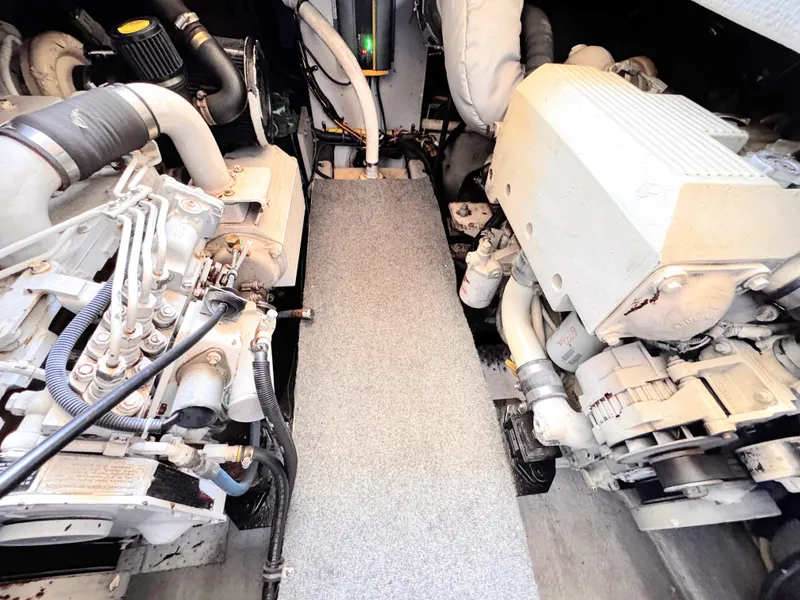 Slide: The Image of Engine room of a 2006 Meridian 341 Sedan yacht, showcasing dual engines and mechanical components. - 26