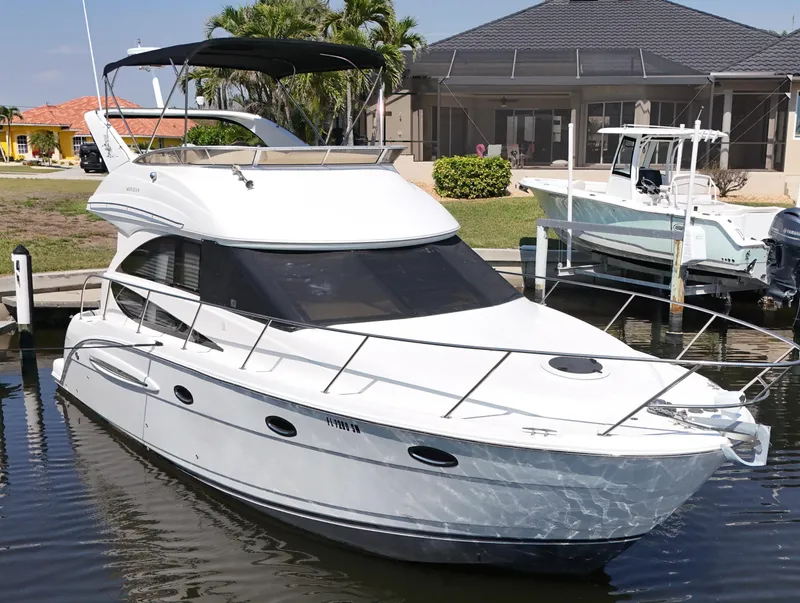 Slide: The Image of 2006 Meridian 341 Sedan yacht docked in a marina, featuring sleek design and modern amenities. - 28