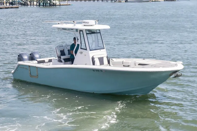 Slide: The Image of 2021 Tidewater 256 CC Adventure boat cruising on open water. - 5