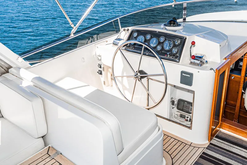 Slide: The Image of Pilothouse of 1987 Fleming 50 Raised Pilothouse yacht with steering wheel and navigation instruments. - 10