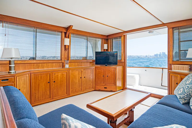 Slide: The Image of Luxurious 1987 Fleming 50 Raised Pilothouse interior with ocean view and elegant wood finish. - 19