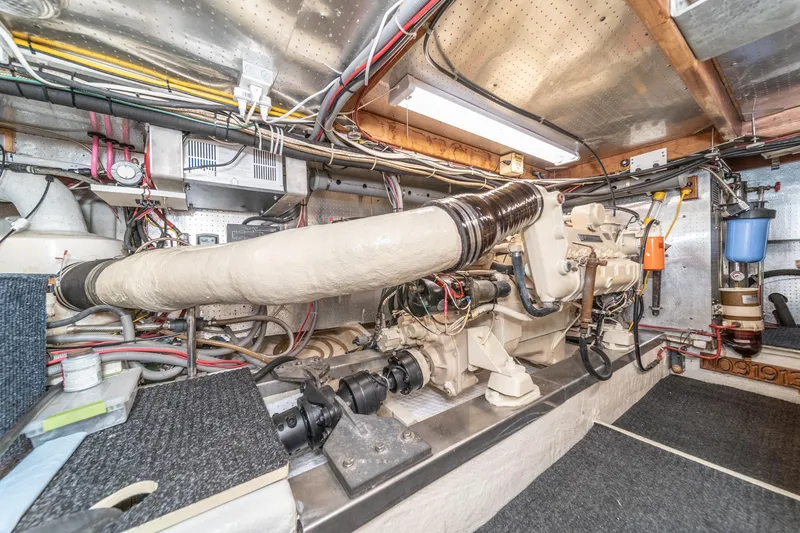 Slide: The Image of Engine room of a 1987 Fleming 50 Raised Pilothouse yacht, showcasing mechanical components. - 37