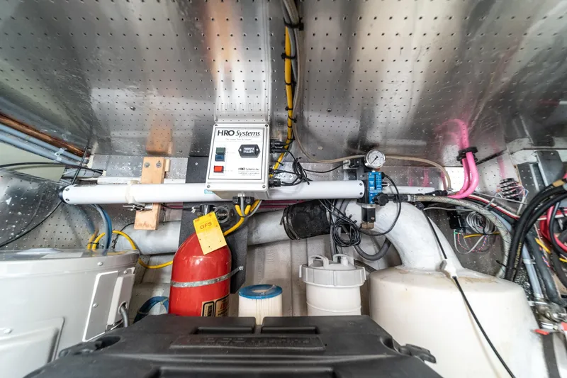 Slide: The Image of Engine room of 1987 Fleming 50 Raised Pilothouse with HRO Systems equipment and fire extinguisher. - 38